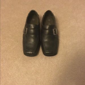 Two pairs of brown and black dress shoes